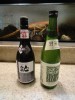 仕込みのしっかりとした「焼」が愉しめる、清潔感溢れる店。若大将に寄せられる期待は大きい。写真は「一八」が開始した東北支援の日本酒。支援はこんな小さな「こころ」から。日本酒